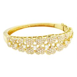 18ct gold diamond heart bangle, two rows of eleven graduating heart motifs, each set with ...
