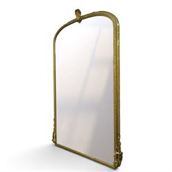 Large Country House late 19th century gilt framed overmantel mirror of arched form, the cartouche and scallop shell pediment over an egg-and-dart and beaded frame, the lower spandrels of scrolling foliate form with acanthus and flower head motifs