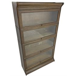 Early 20th century oak stacking library bookcase, four sections with hinged and sliding glazed doors