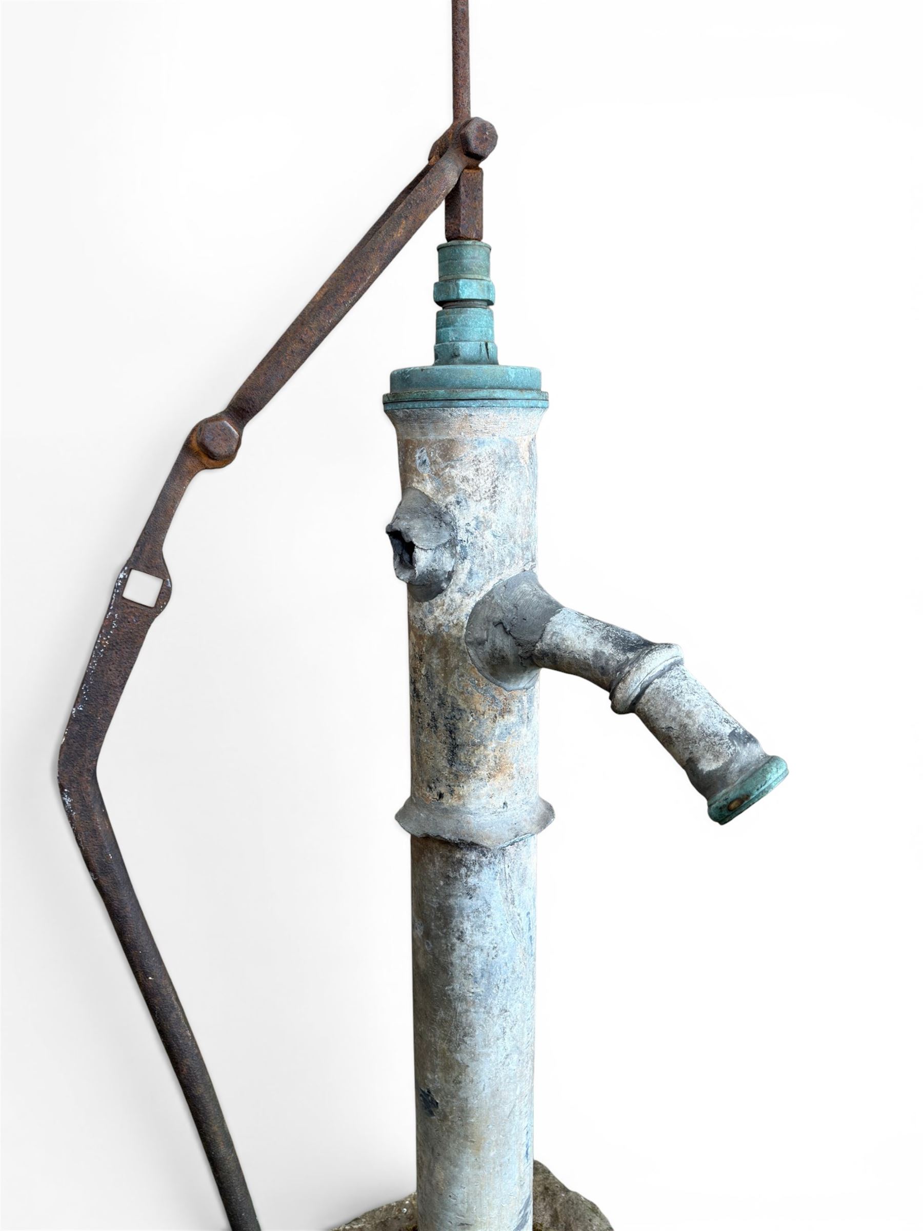 Georgian period lead garden water pump, with iron handle, set in square stone base