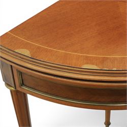 Regency revival mid 20th century walnut card table, demi lune form inlaid with boxwood, kingwood frieze with brass detail fold-over top with retractable back leg, revealing circular leather playing surface, circular tapering legs