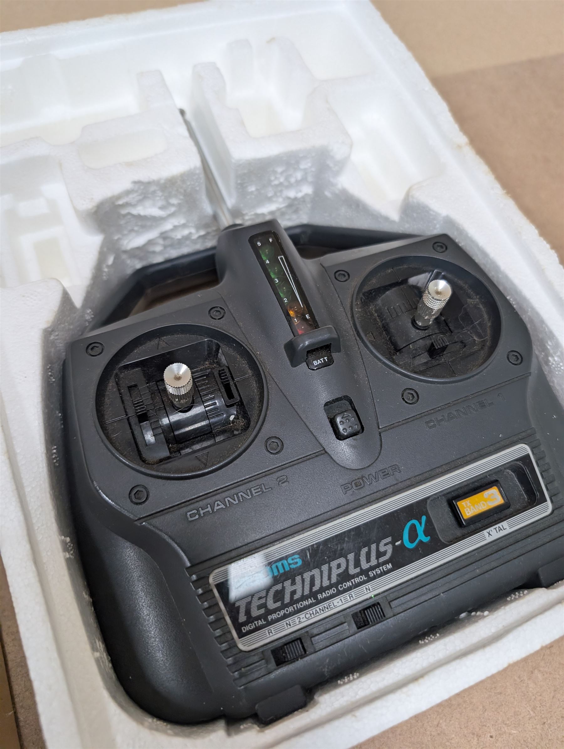 Tamiya 'The Grasshopper' 1:10 scale remote control car, boxed, together with an Acombs Techniplus-a controller, both boxed