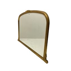 Victorian design gilt frame overmantel mirror, the arched frame topped with flower head and extending acanthus leaves, with beading along the frame, enclosing bevelled plate
