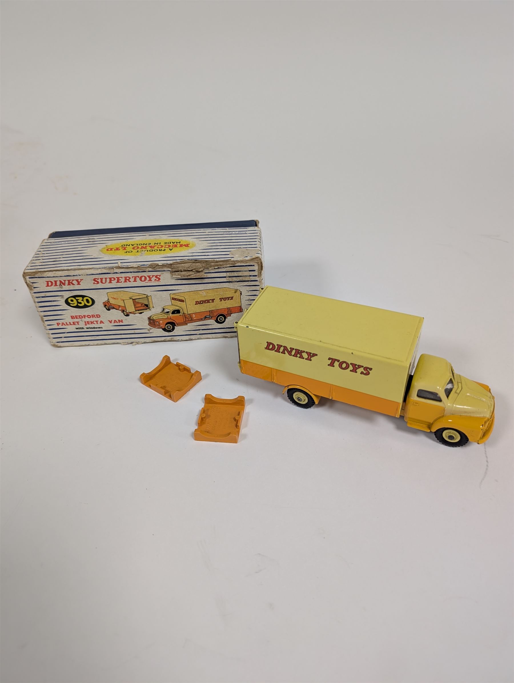 Dinky Toys Bedford Pallet Jekta Van no 930, two tone yellow body with red 'Dinky Toys' lettering, in original box with two orange pallets and instructions