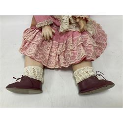 Reproduction Simon & Halbig bisque head doll with applied hair and jointed limbs; marked Simon & Halbig 117, H58cm