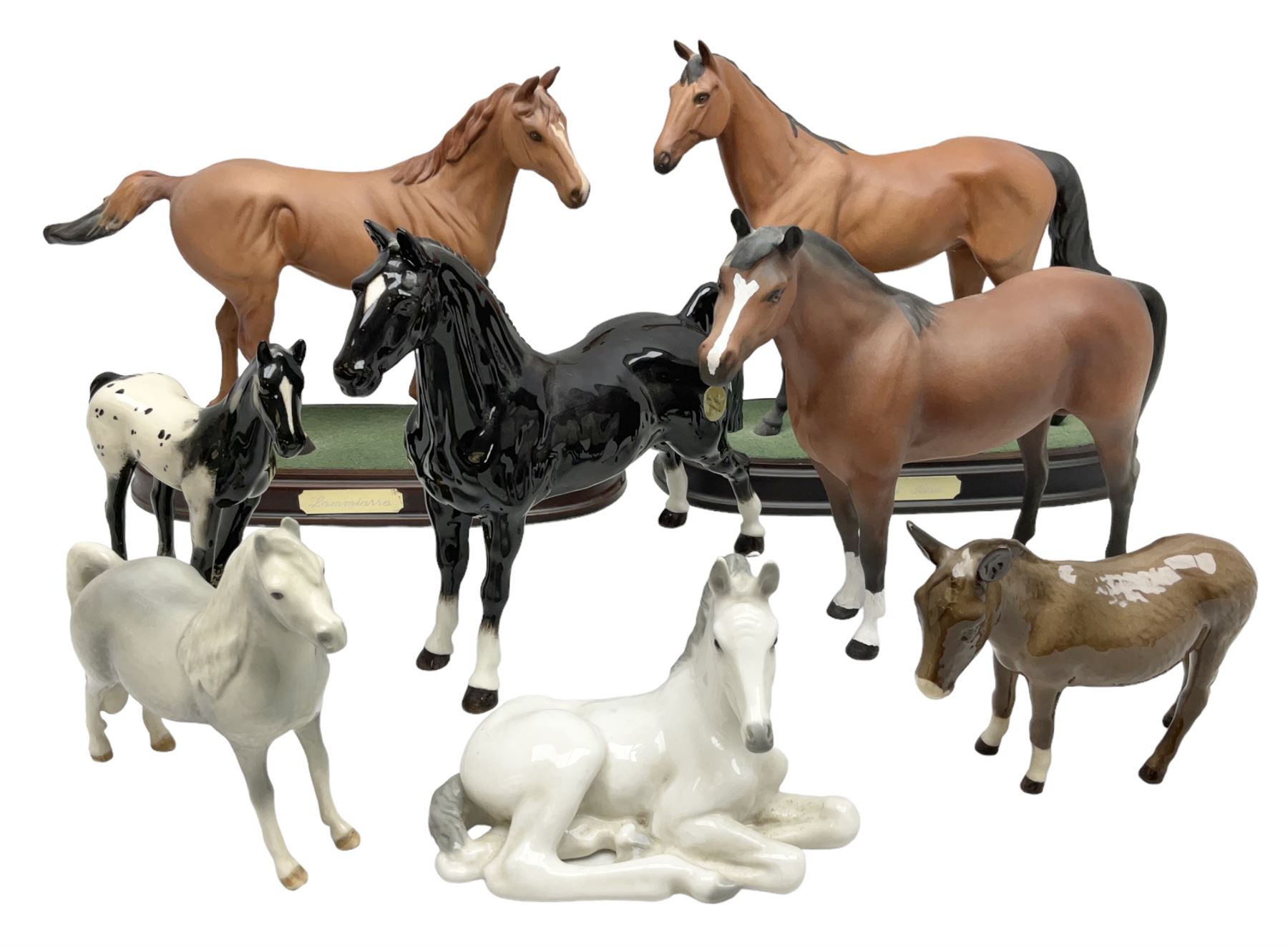 Collection of Beswick horse figures, to include Red Rum on a wooden plinth,  Lammtarra on oval plinth, Morgan Horse Black and three others, together with Royal Daulton Appaloosa Foal and a USSR horse
