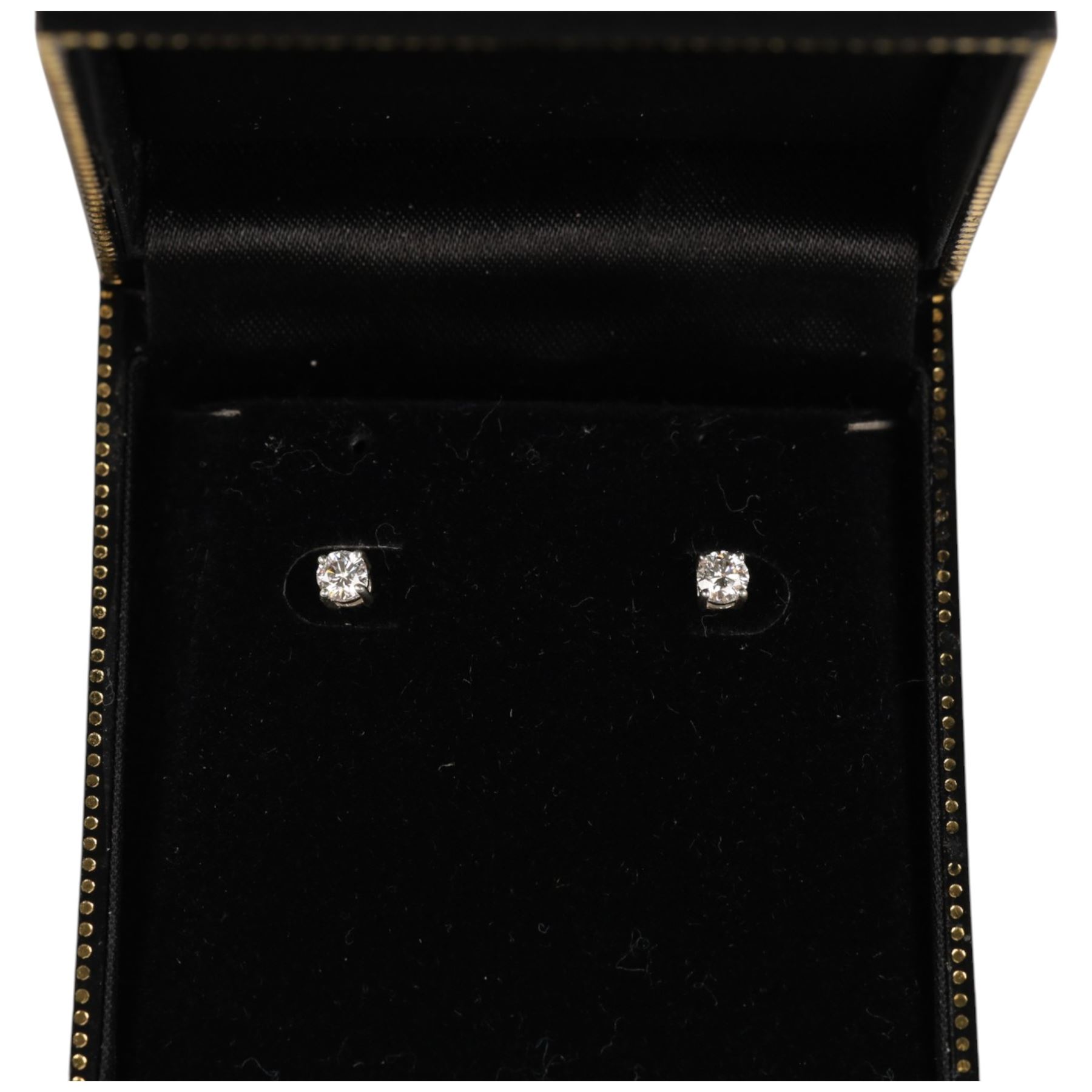 Pair of sliver diamond stud earrings, boxed