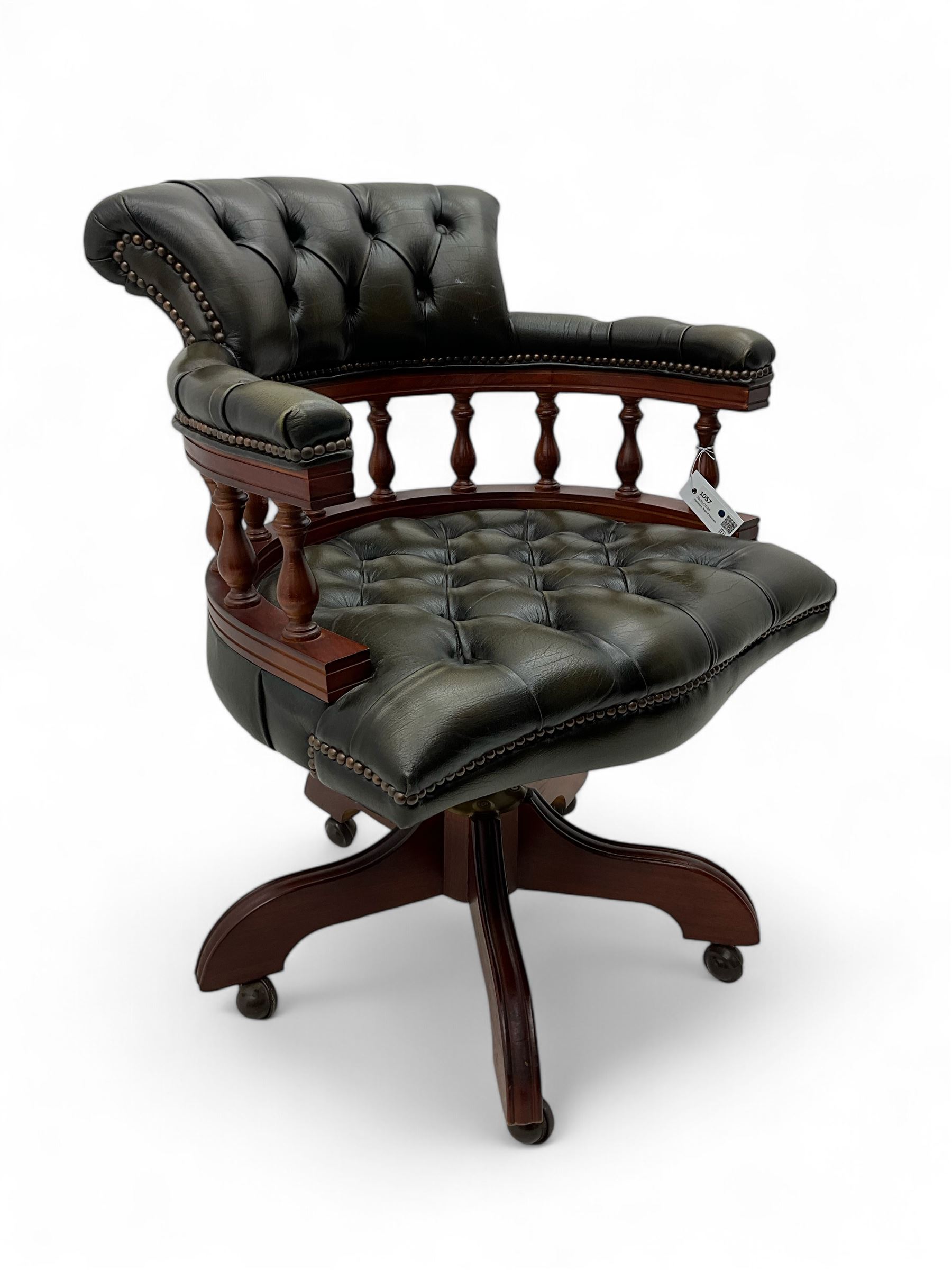 Captain's swivel desk chair, upholstered in studded green leather