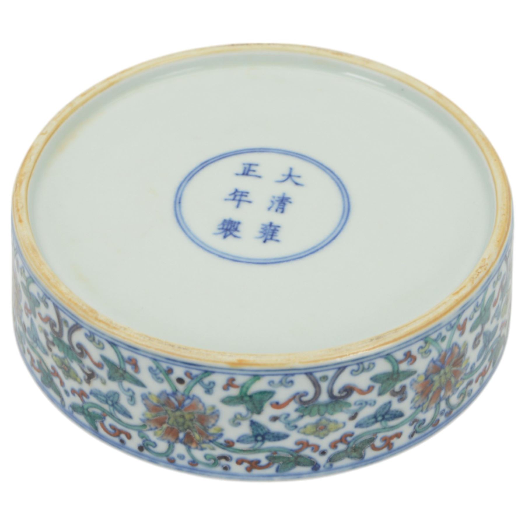 20th century Chinese Doucai box, of circular form, decorated in polychrome enamels with flowers and foliage, with character marks beneath, D18cm, H9cm