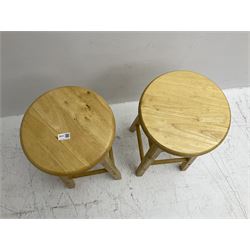 Two light oak bar stools with swivel tops