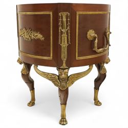 An imposing and richly adorned Empire Revival jardiniere of circular form, decorated with finely cast gilt bronze laurel garlands and floral swags, interior with a modern brass liner, sides with gilt bronze carrying handles, raised on three tripod legs with classical caryatid masks with wings terminating in lion paw feet, circa 1900

Provenance: This jardiniere formed part of the original furnishings of the opulent Empire Room at Kinloch Castle, built by industrialist George Bullough in 1900.

An original inventory number, ‘X954’, is inscribed on one facing, verifying its presence in the Kinloch Castle collection. This jardiniere epitomises the lavish taste of the Edwardian elite and the high standards of craftsmanship employed in the furnishing of Kinloch Castle, the first private home in Scotland to be lit by electricity and famed for its extravagant interiors.


