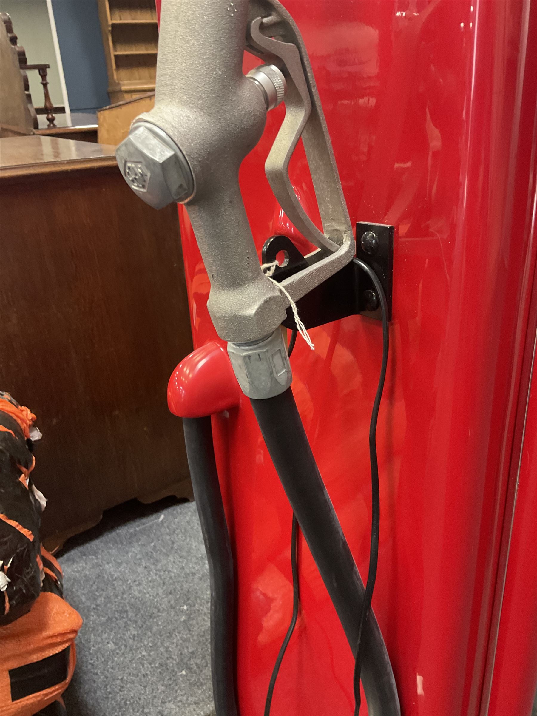 Roadside Relics Fender Custom Shop guitar display case, modelled as an American petrol pump, with a circular two-tone Fender logo light upon the pillar box red cabinet, three sides with glazed panels and chrome detailing, one etched with Fender logo, the interior with removable guitar stand, height including light 184cm