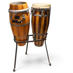 Three conga drums, comprising two Excelsior A. Salvadori Firenze stave-built wooden congas and one similar French example, with skin heads and metal tension mounts, on metal stands with hard carry cases for drums, tallest H79cm, D31cm
