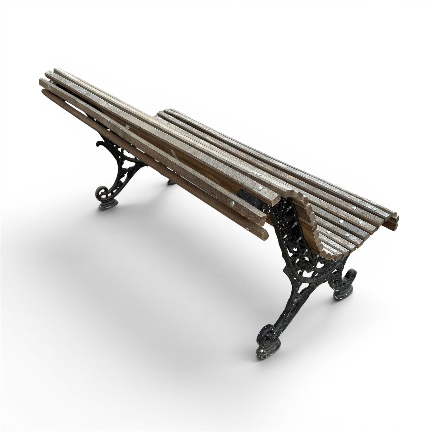 19th century cast iron and wood slatted garden bench, serpentine scroll form, ornate bow ends finished in green paint
