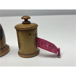 Six sewing related Mauchline ware comprising an oval reel box with internal label for Clark & Co's, tape measure, pin case and three thimble holders of ovoid form 