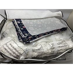 Large quantity of various linen and fabrics to include patterned quilted bedspread, etc