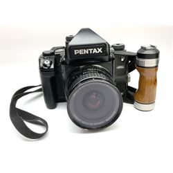 Pentax 67II camera with Asahi SMC Pentax - 6x7 ‘1:4 45mm’ lens, Asahi Takumar / 6x7 ‘1:4.5/75’ lens, Asahi Macro-Takumar / 6x7 ‘1:4/135’ lens, Asahi SMC Pentax - 6x7 ‘1:2.8 165mm’ lens, Asahi Pentax 6x7 rear converter ‘T6-2X’, lens filters and various other accessories, housed in a Billingham carry bag