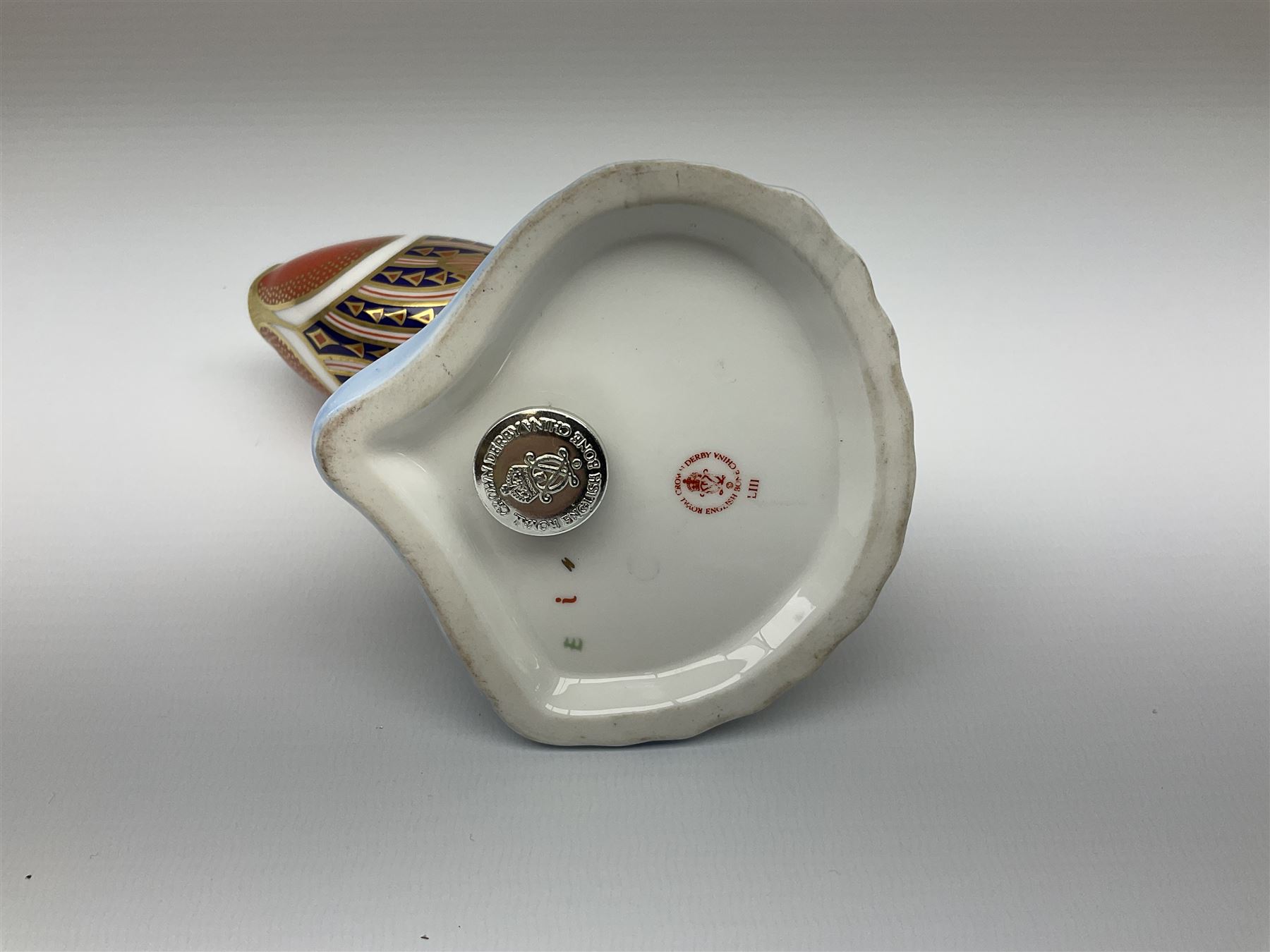 Royal Crown Derby tropical fish paperweight in the form of a Guppy, with a silver stopper, and Royal Crown Derby tortoise paperweight with gold stopper