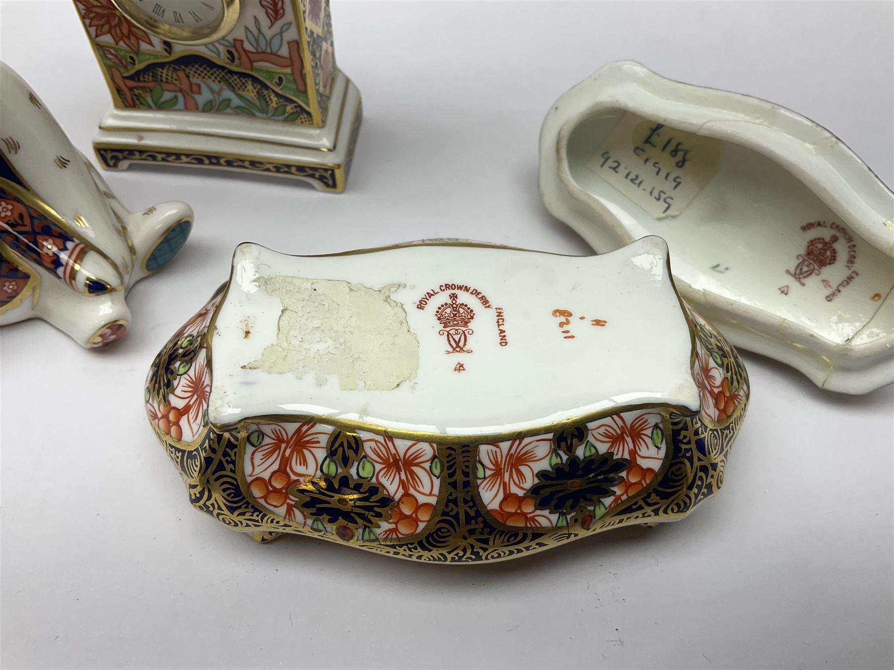 Royal Crown Derby Haiku pattern miniature clock, together with 1128 Imari pattern trinket box with cover and teddy bear figure, all with printed marks beneath   
