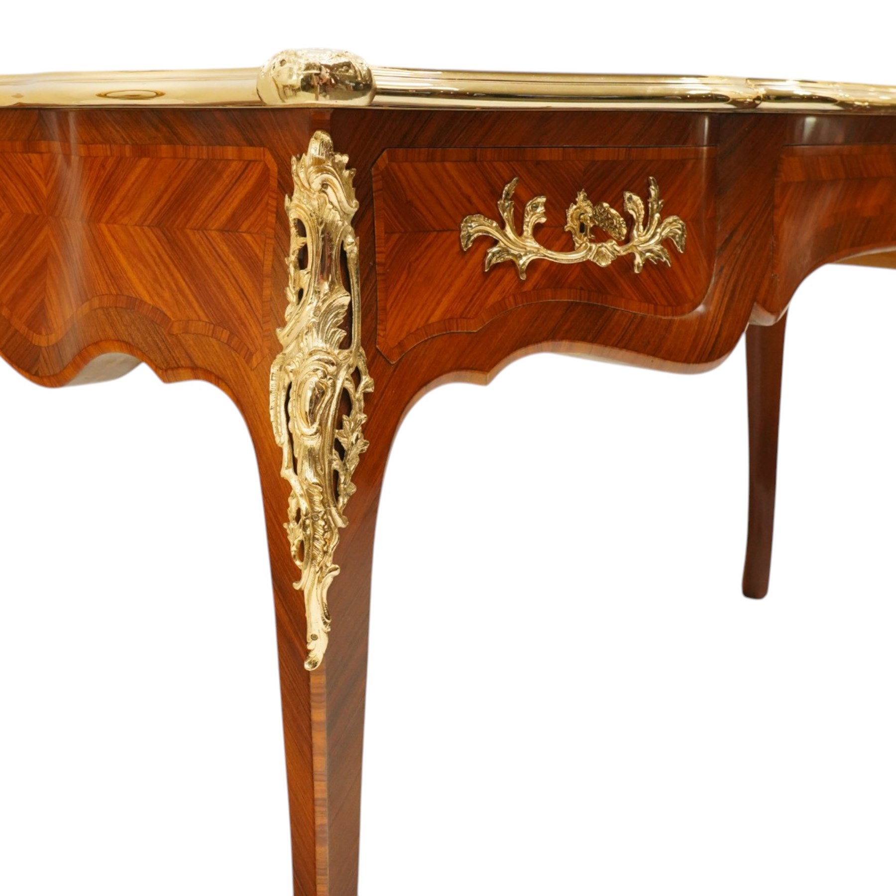 Baggio Anciens Meubles - Italian Louis XV style kingwood and gilt metal mounted bureau plat or writing desk, the shaped rectangular top with inset leather writing surface with gilt metal edge, above three shaped frieze drawers with gilt metal handles, raised on cabriole supports with gilt cartouche mounts to the knees and scroll feet