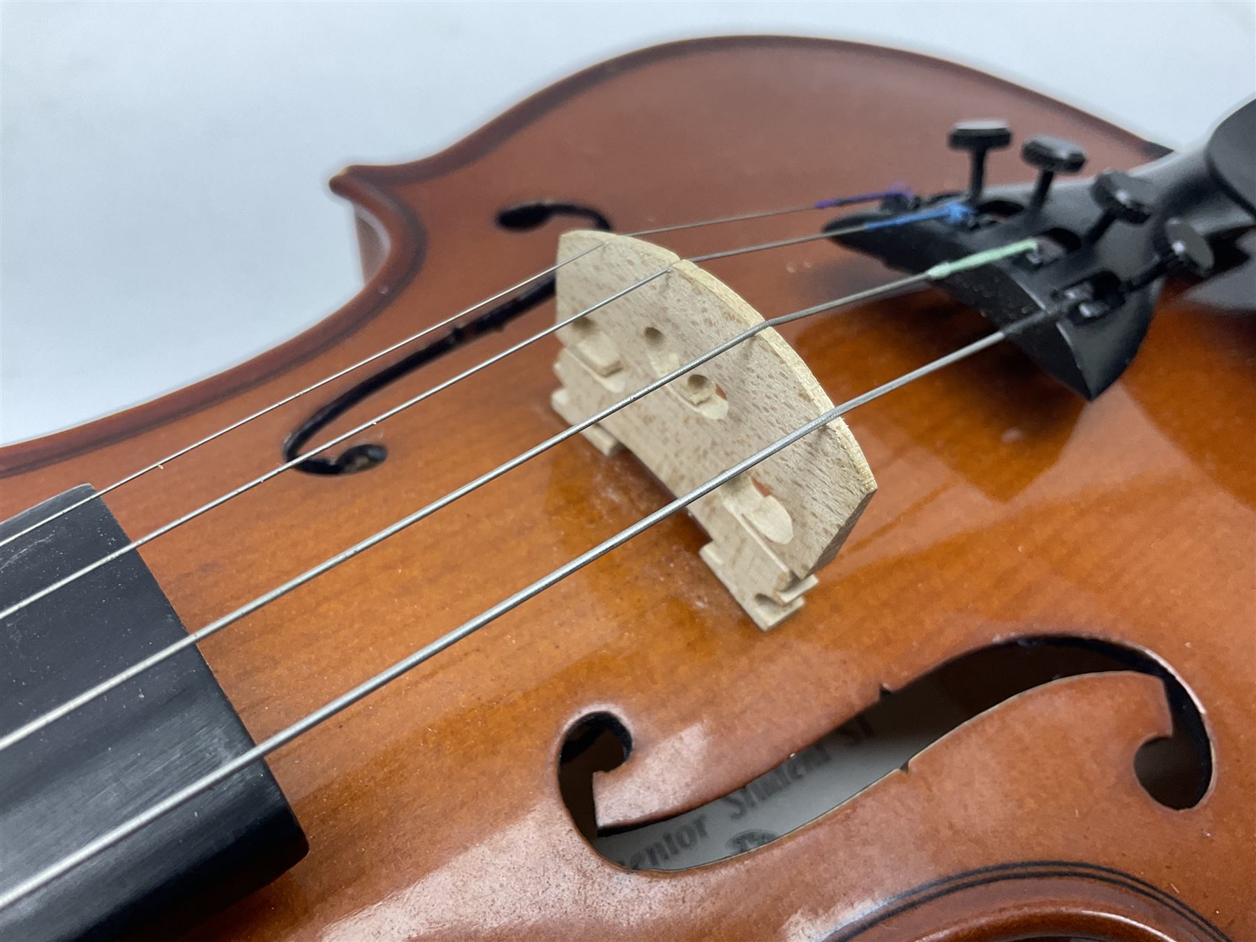 Four student violins - two Chinese three-quarter size with 33.5cm and 34cm two-piece backs; Stringers of Edinburgh quarter size with 28cm two-piece back; and Stentor quarter size with 28cm two-piece back; each in carrying case (4)