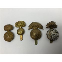 Nineteen Yeomanry metal cap badges including Derbyshire, Northamptonshire, Essex, Glamorgan, Staffordshire, City of London, Surrey, Shropshire, Hertfordshire etc; together with eleven Fusiliers badges including Lancashire, Royal Welch, Northumberland etc (30)