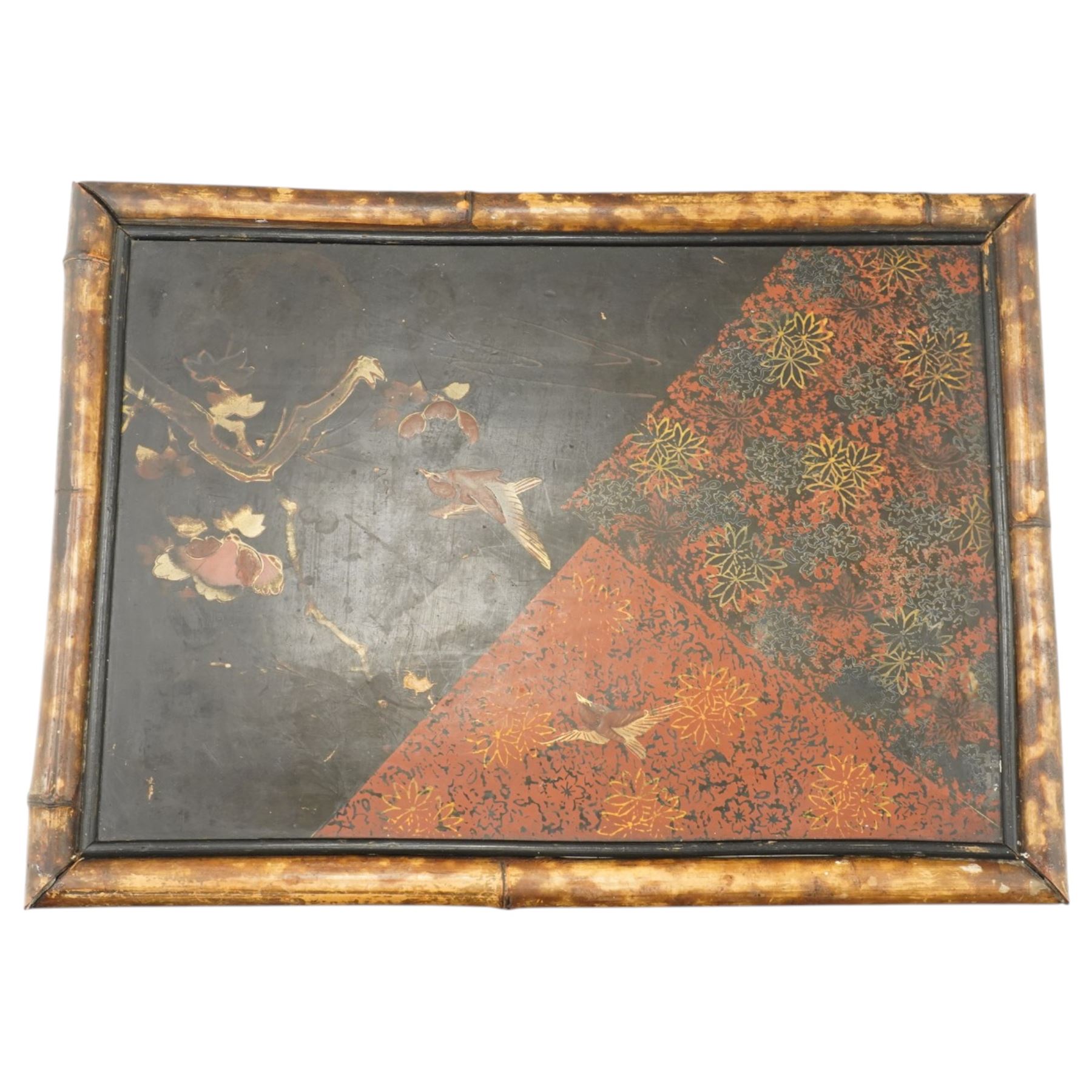 Bamboo and chinoiserie occasional table, rectangular top with geometric print and foliate design, raised on bamboo supports united by an undertier