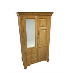 Pine double wardrobe, moulded cornice over single mirror front door over three drawers and opposing panelled door, on ogee feet