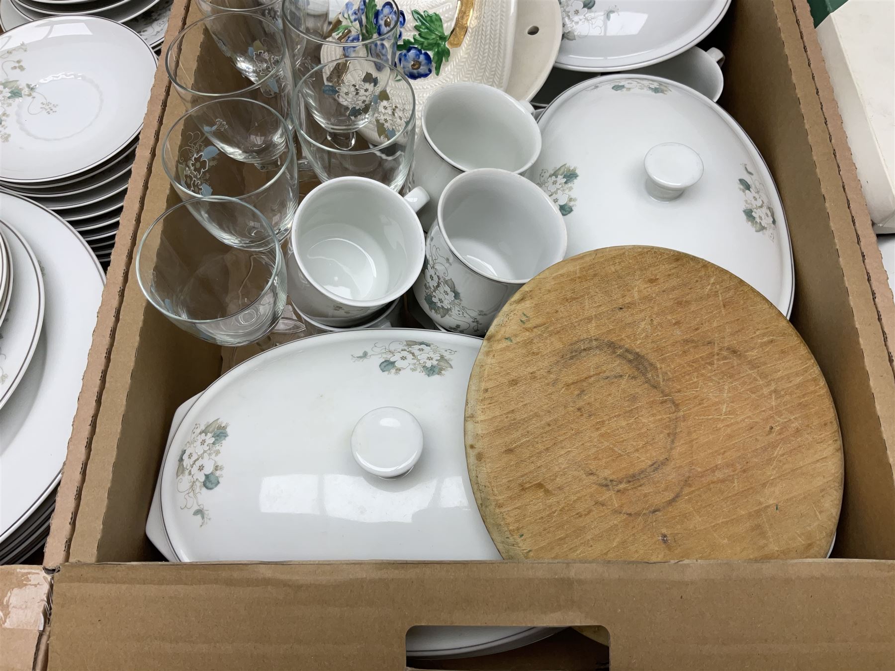 Large quantity of Porcelana Real Brasil White Blossom pattern tea and dinner wares, to include dinner plates, tea cups and saucers, salt and pepper pots, tureens, pie dishes coffee pots, place mats, spoons and glasses, etc, in five boxes 