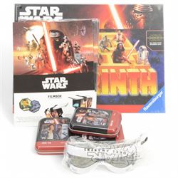 Star Wars puzzles and games, including four sealed MB Games 200piece jigsaw puzzles, two Darth Vader sculpture puzzles, limited edition sealed Ravensburger The Force Awakens Labyrinth game, two Special Edition Star Wars Trilogy Mousemats in original packaging, and a collection of Star Wars The Force Awakens ephemera including tins, flags, 3D glasses, etc