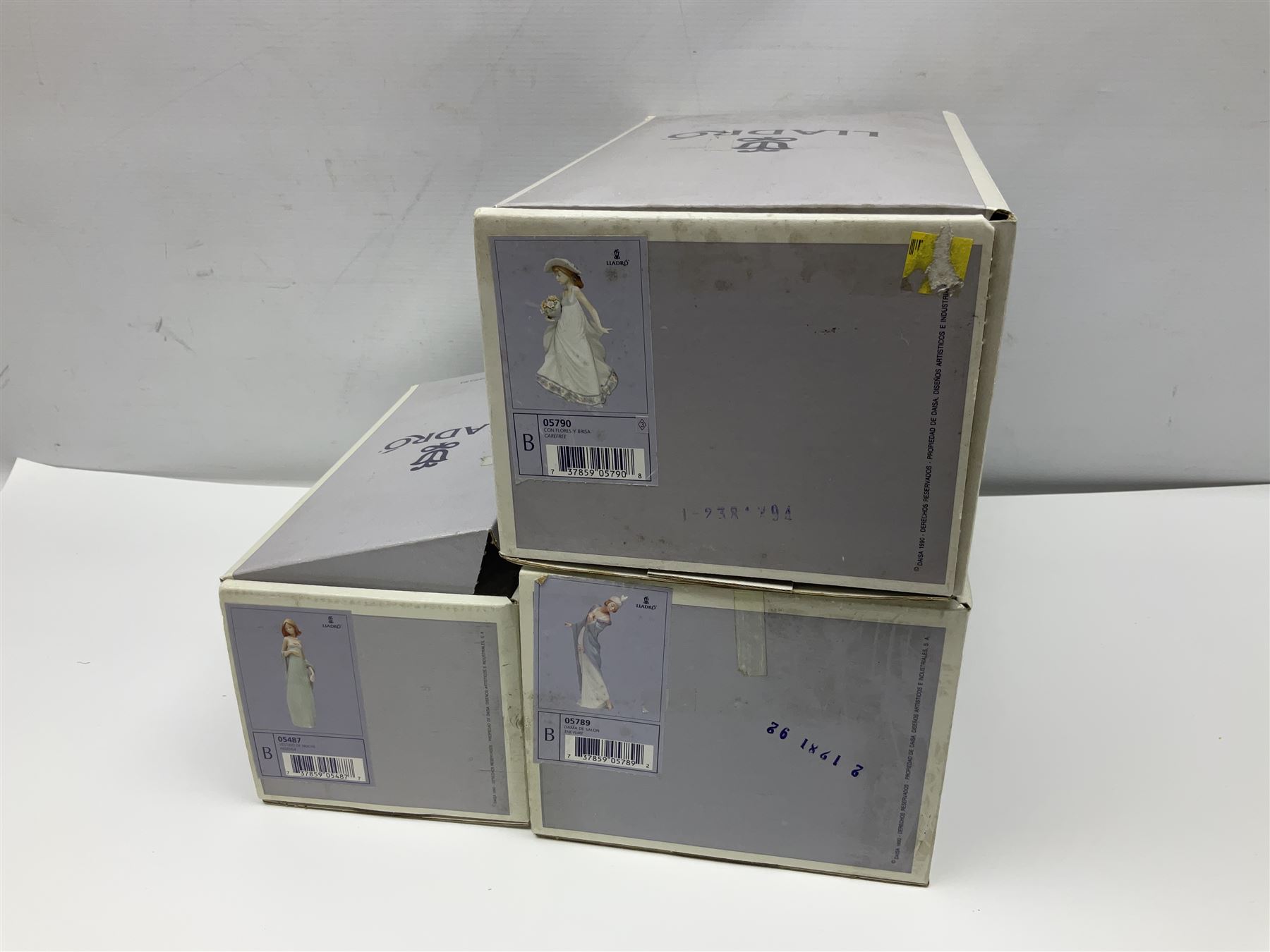 Three Lladro figures of ladies comprising 'The Flirt' model no 5789, 'Ingenue' model no 5487 and 'Carefree' model no 5790, all with boxes