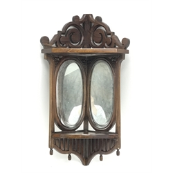  20th century mahogany wall hanging corner shelf fitted with two oval mirrors, W45cm, H83cm, D34cm  