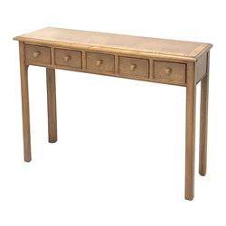 Contemporary oak, mahogany, and figured burr walnut narrow console table, moulded rectangular top with oak band and satinwood stringing, five cock beeded short drawers with turned handles, moulded and canted square supports 