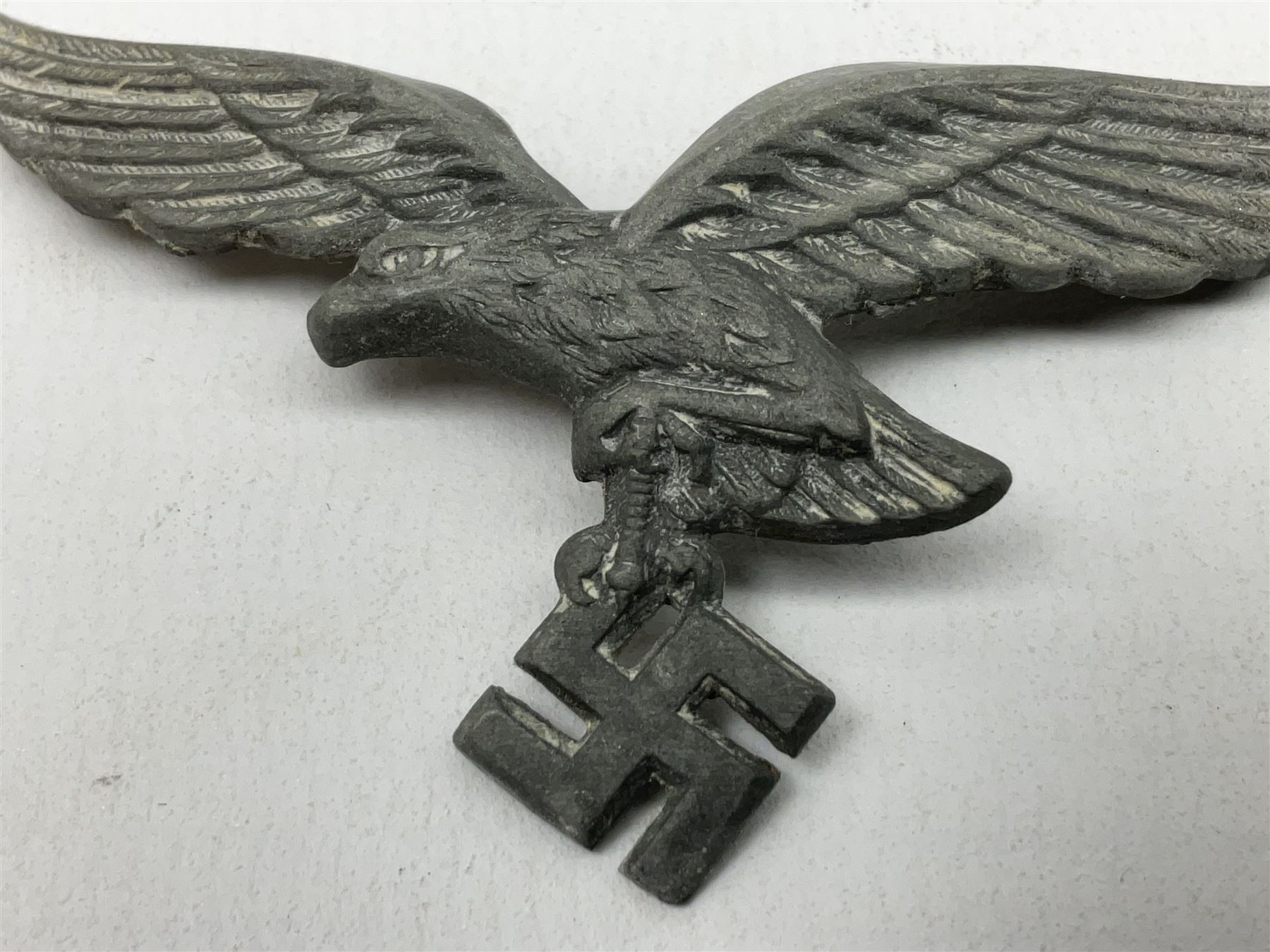 Five WW2 German peaked cap badges, four with double-pinned backs