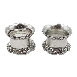 Pair of silver napkin rings floral and foliate borders by Walker & Hall, Sheffield 1905/7, approx 5oz