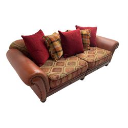 Grande traditional design four seat sofa, upholstered in studded red leather and kilim style fabric, with contrasting scatter cushions