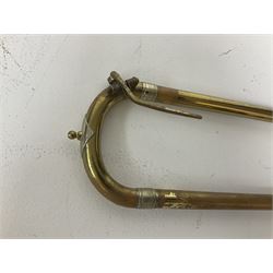 Three brass trombones comprising Elkhart Ind. USA 'CONN' model no.72H; Besson 'Concord'; and Selmer Distributed 'Lincoln'; two in carrying cases; and German B & M 'Champion' brass trumpet (4)