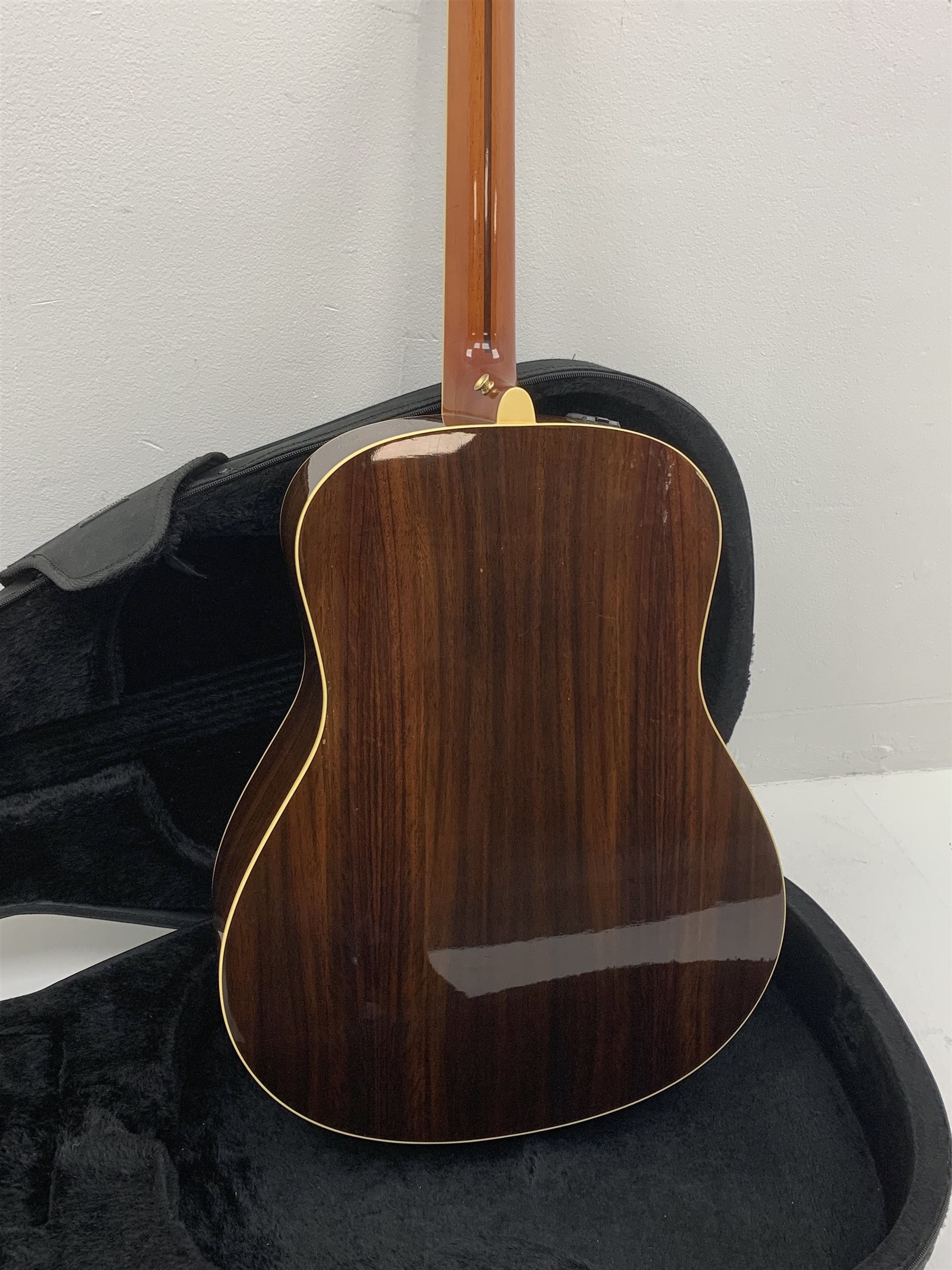  Yamaha model LLX6A acoustic/electric guitar with rosewood back and sides and spruce top, fitted with Yamaha tuner, serial no. QPH150011, L104cm, in hard carrying case. From the collection of the late John Burgess of Beverley who played in the bands Penjants, Wine, Strollers, Revox, Sound Foundation, Pickle Belly Alley, Ragamuffins and Jerryattricks.
