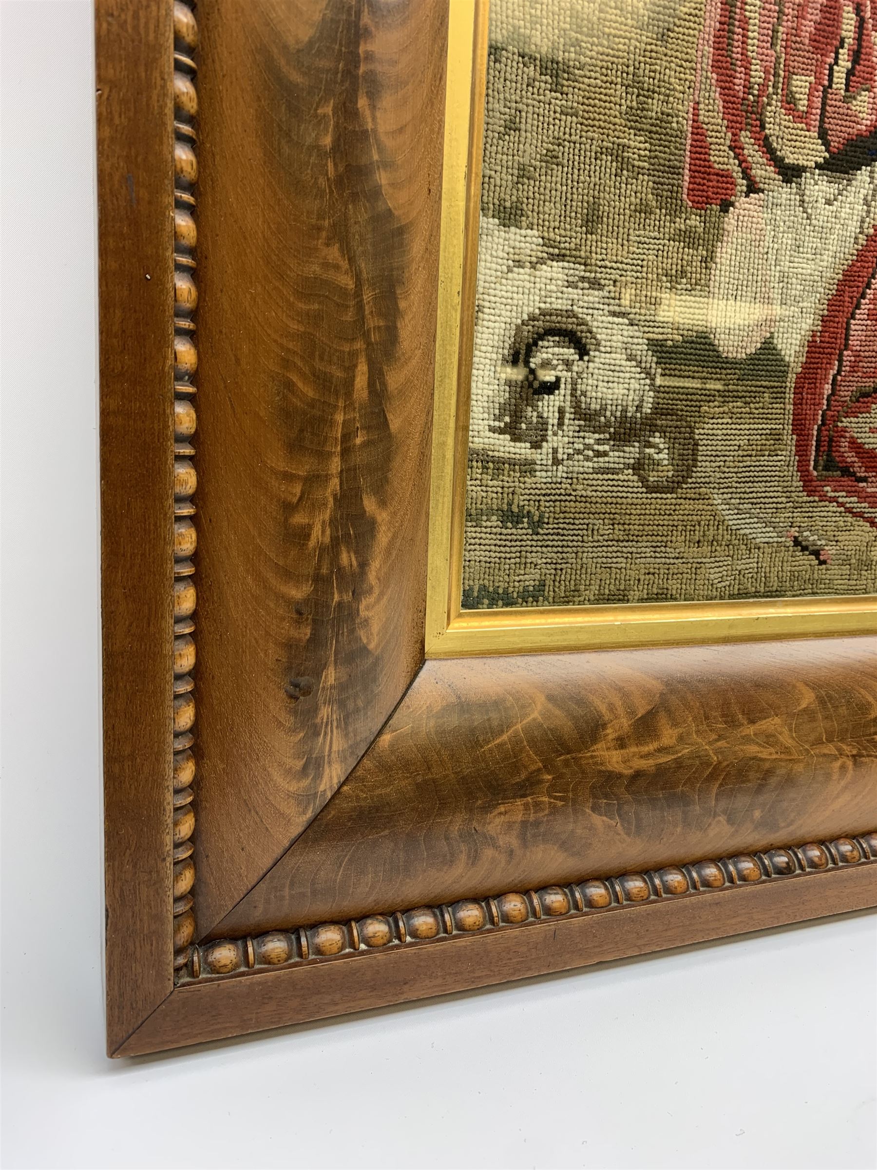 FRAMES - Victorian figured mahogany frame, with egg and dart edging and a gilt slip, containing a Berlin woolwork picture depicting Abraham and Isaac, H78cm W69.5cm