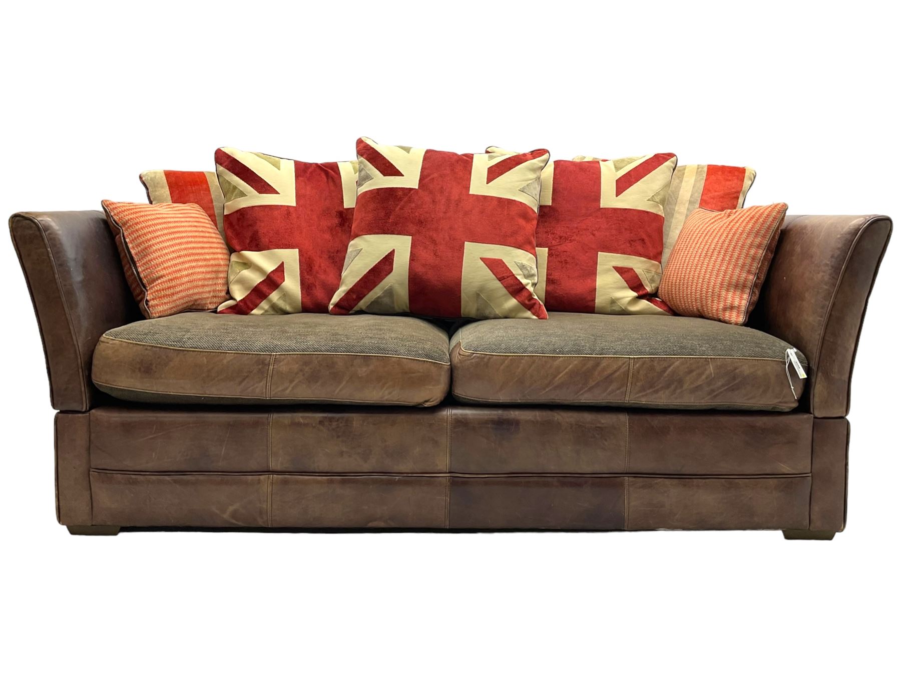Large Knole design three-seat sofa upholstered in brown leather with scatter cushions upholstered in contrasting striped and Union Jack patterned fabric, on block feet (W210cm, H100cm, D102cm); together with matching rectangular footstool (135cm x 75cm, H45cm)