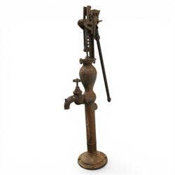 Early 20th century cast iron floor standing water pump, cylindrical column with bulbous chamber, side spout with star-shaped tap, lever action mechanism with ratchet adjustment, flanged circular base, H 127cm