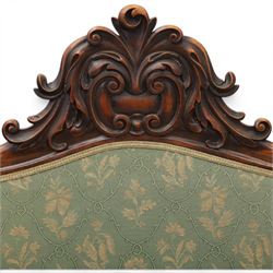 Victorian mahogany framed sofa, scroll arms with double camel back, green geometric upholstery, raised on turned supports