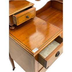 Edwardian inlaid mahogany dressing table, oval swing mirror, trinket drawers, above two small and two long drawers
