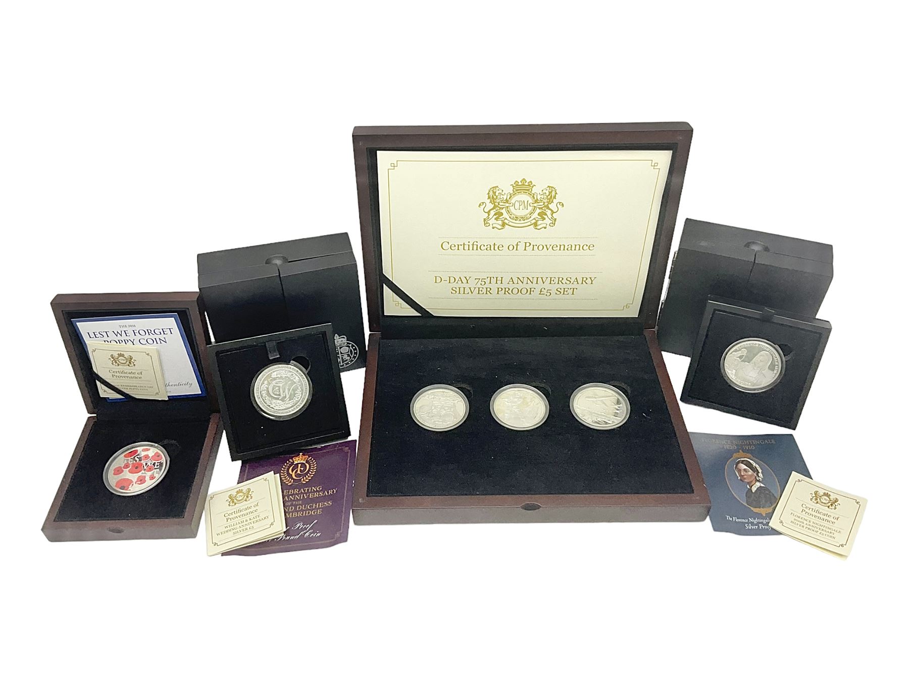 Queen Elizabeth II Channel Islands and Isle of Man silver proof five pound coins, comprising Bailiwick of Jersey 2016 'Lest we Forget', 2019 'D-Day 75th Anniversary' three coin set', Bailiwick of Guernsey 2020 'Florence Nightingale 200th Anniversary' and Isle of Man 2021 'William and Kate Wedding Anniversary', all cased with certificates