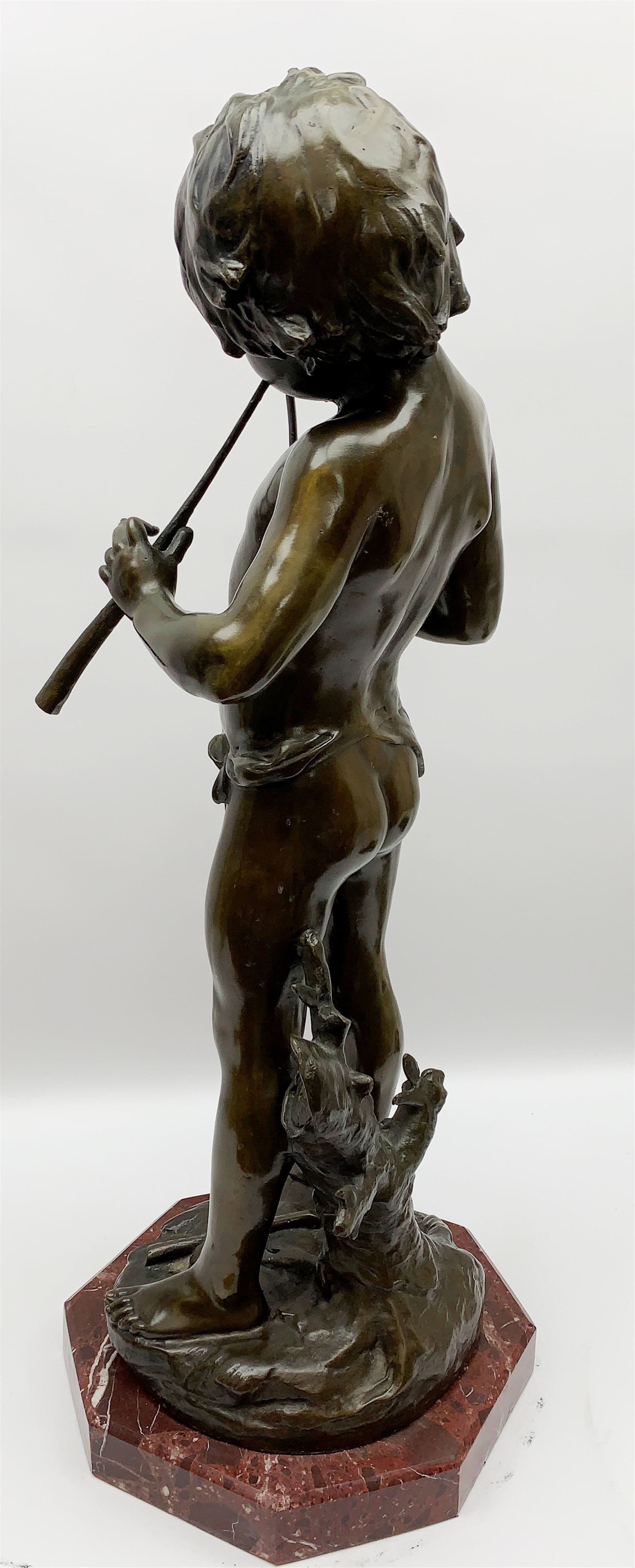 After Auguste Moreau (French 1834-1917): large bronze figure modelled as a young boy playing two pipes, standing upon a naturalistically modelled base detailed with tree stump and further pipe, signed Aug Moreau, upon octagonal red marble base, H72cm 