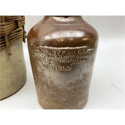 19th century stoneware gin bottle impressed I. Peck, Spirit Merchant Hull H27cm, Victorian salt glazed stoneware jar embossed W. Jefferson Mustard Manufacturer 47 Wincolmlee Hull, part cane covered stoneware flagon for John Smith Market Place Beverley and a Barton-on-Humber stoneware ginger beer bottle (4)  
