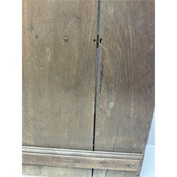 George III oak spoon rack and candle box, the rectangular backplate with shaped  pediment and two six aperture spoon racks, above a candlebox with hinged cover, with various brass spoons and a pair of brass candle snuffers, H56.5cm, W35cm, D14cm 