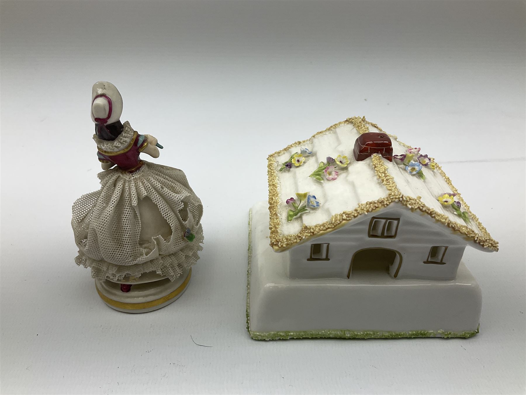 Group of figures, comprising six Royal Doulton examples, Daydreams HN1731, Silks and Ribbons HN2017, Tom Sawyer HN2926, Marie HN1370, Bo-Peep HN1811, and Tinkle Bell HN1677, together with a Dresden type 'lace' example, and a Coalport 'Swiss Cottage', (8)