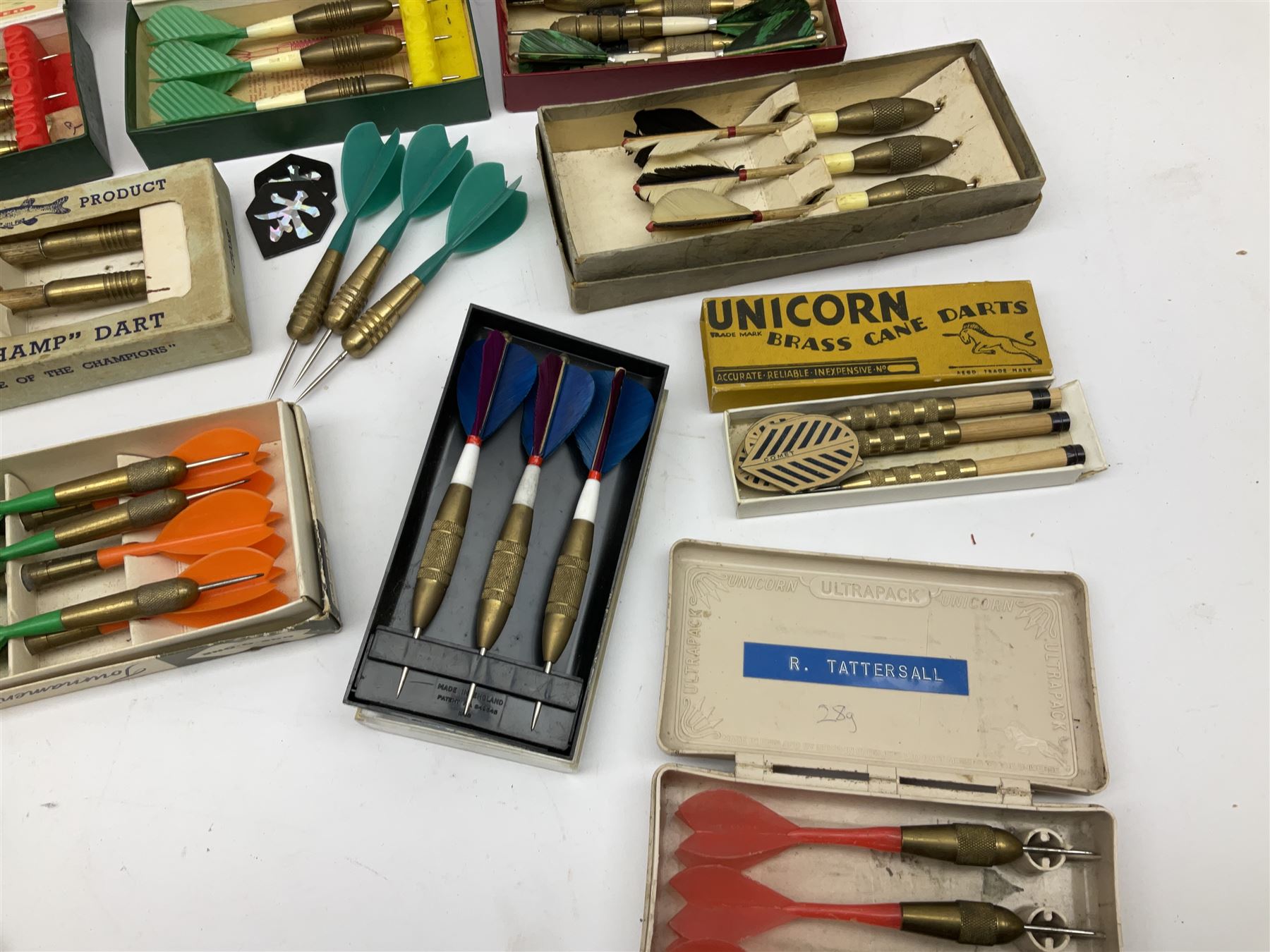 Nineteen sets of dartboard darts by Unicorn, Jim Pike, 'One-o-One', Farebrother etc, with various flights, shafts, styles and weights; predominantly boxed