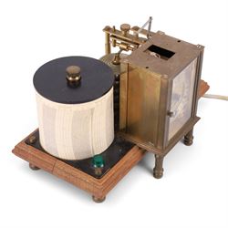 Brass barograph with integral brass clock, upon a wooden wooden plinth